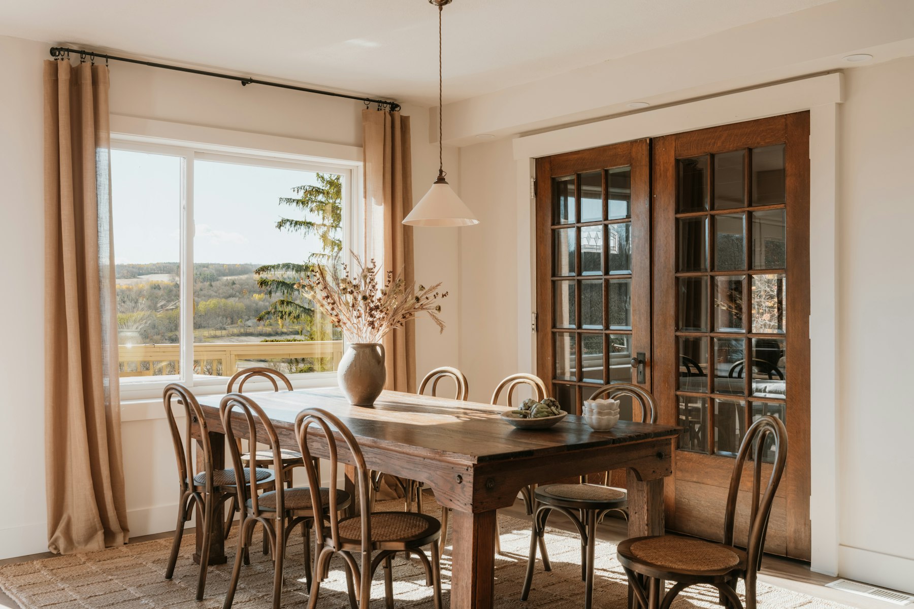 Warm wood dining room with natural light